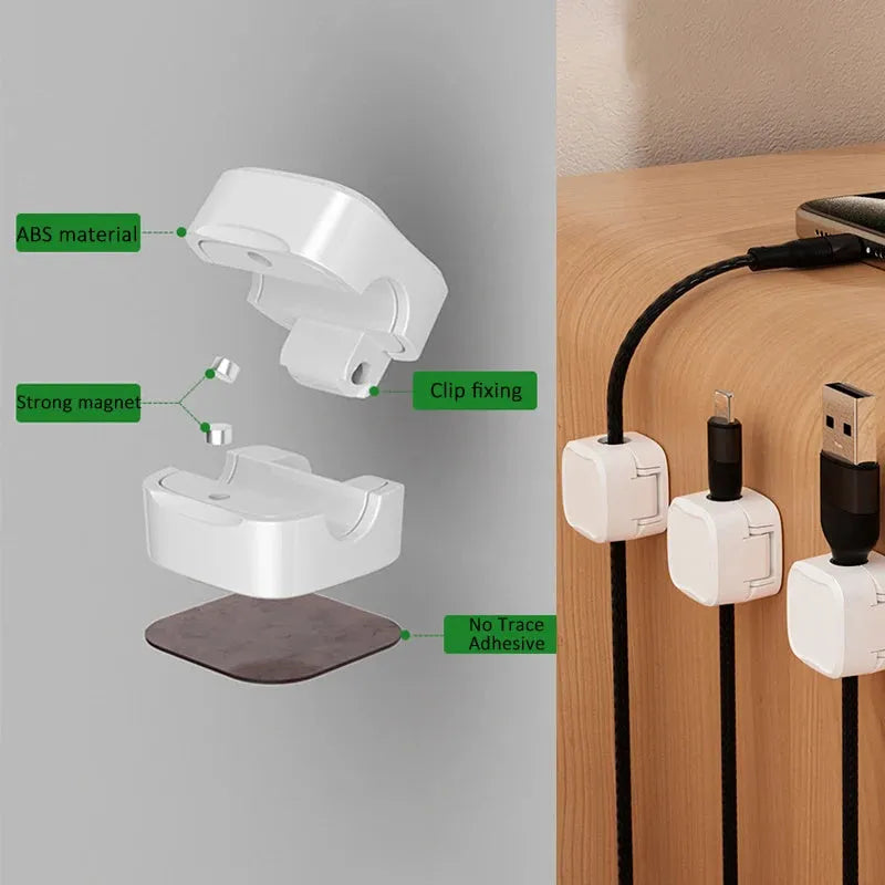 White and black cable clips holding under desk wires including USB and HDMI cables