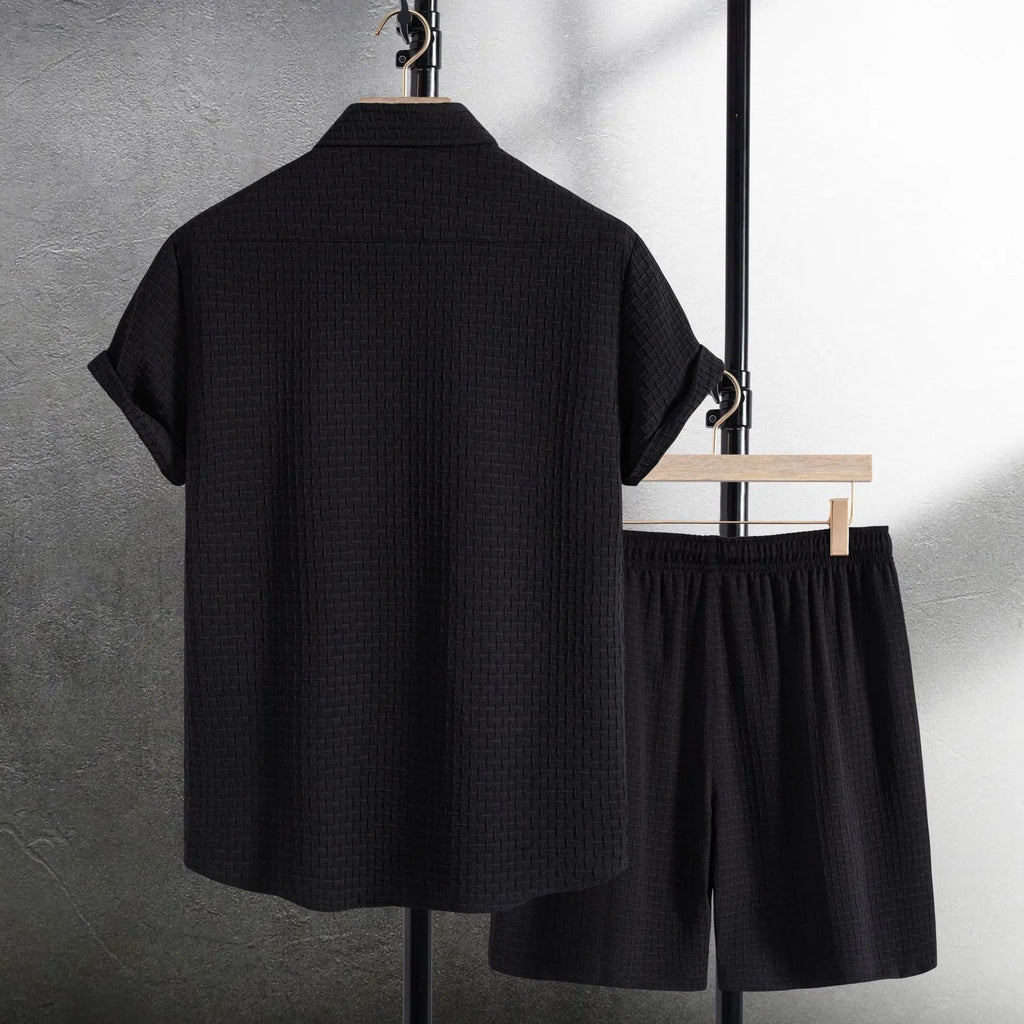 Men's black cotton blend short sleeve shirt and shorts casual summer suit on a hanger.