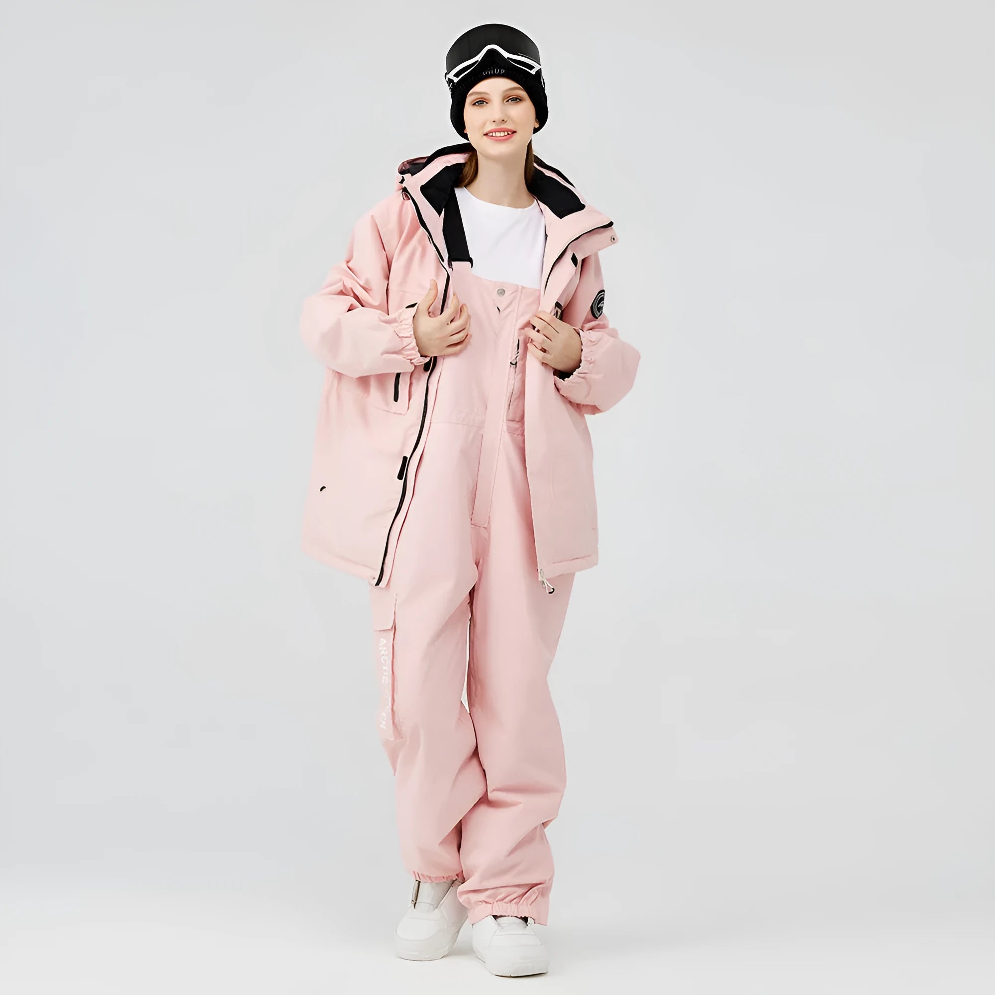 Unisex waterproof ski suit in blue top with black pants for winter snow sports