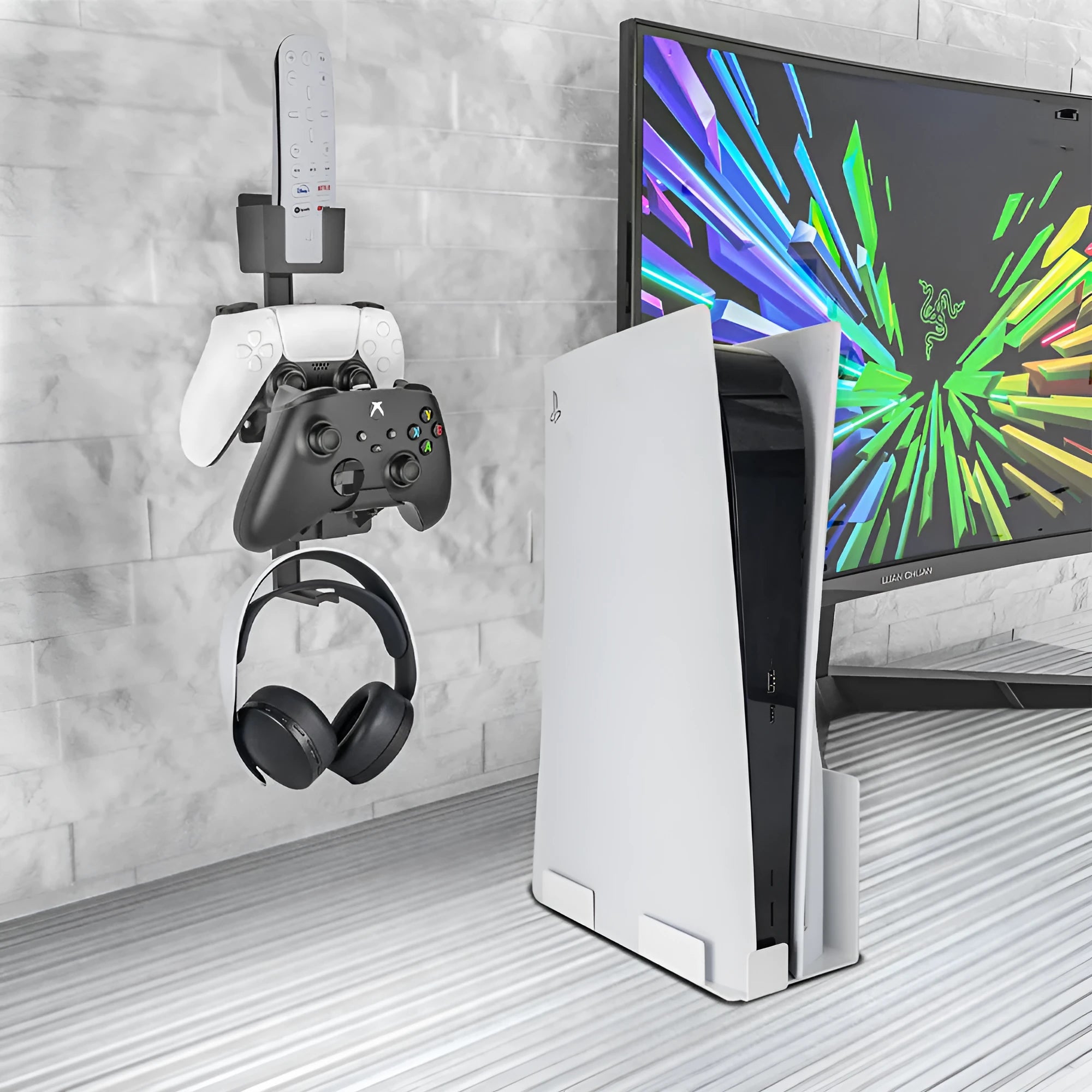 White ABS plastic wall-mounted hook holding a PS5 controller and gaming headset.