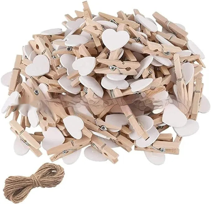 Five solid wood heart-shaped clips in red colour arranged together