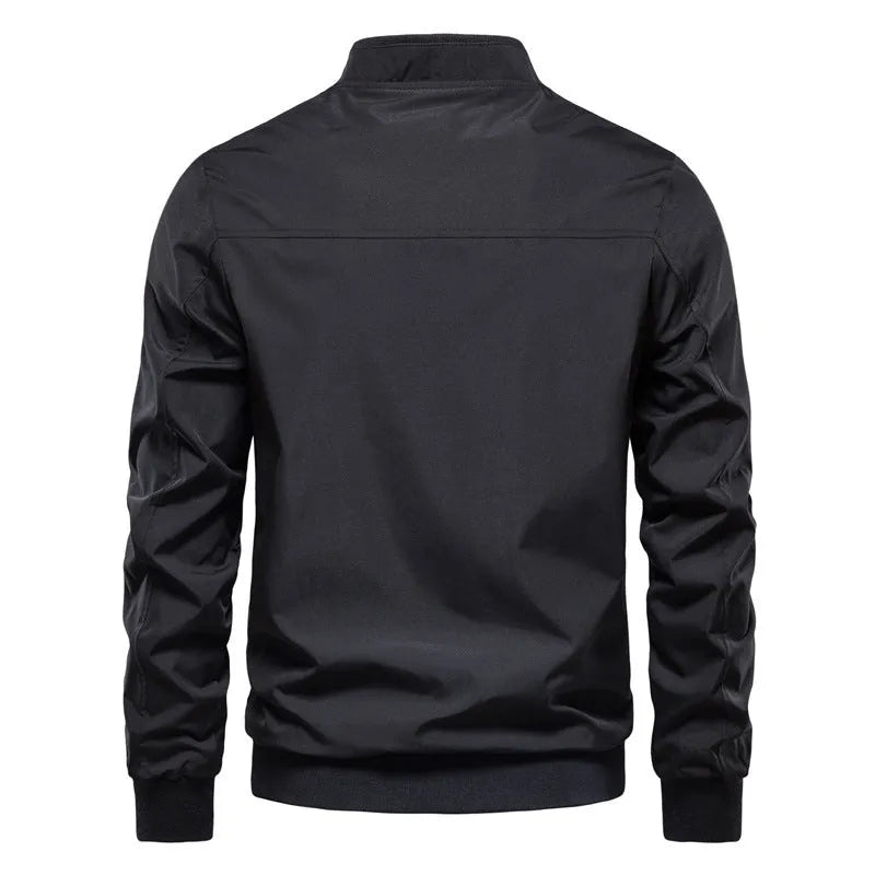 Men's solid colour thin casual jacket in polyester available in dark blue, black, or army green.