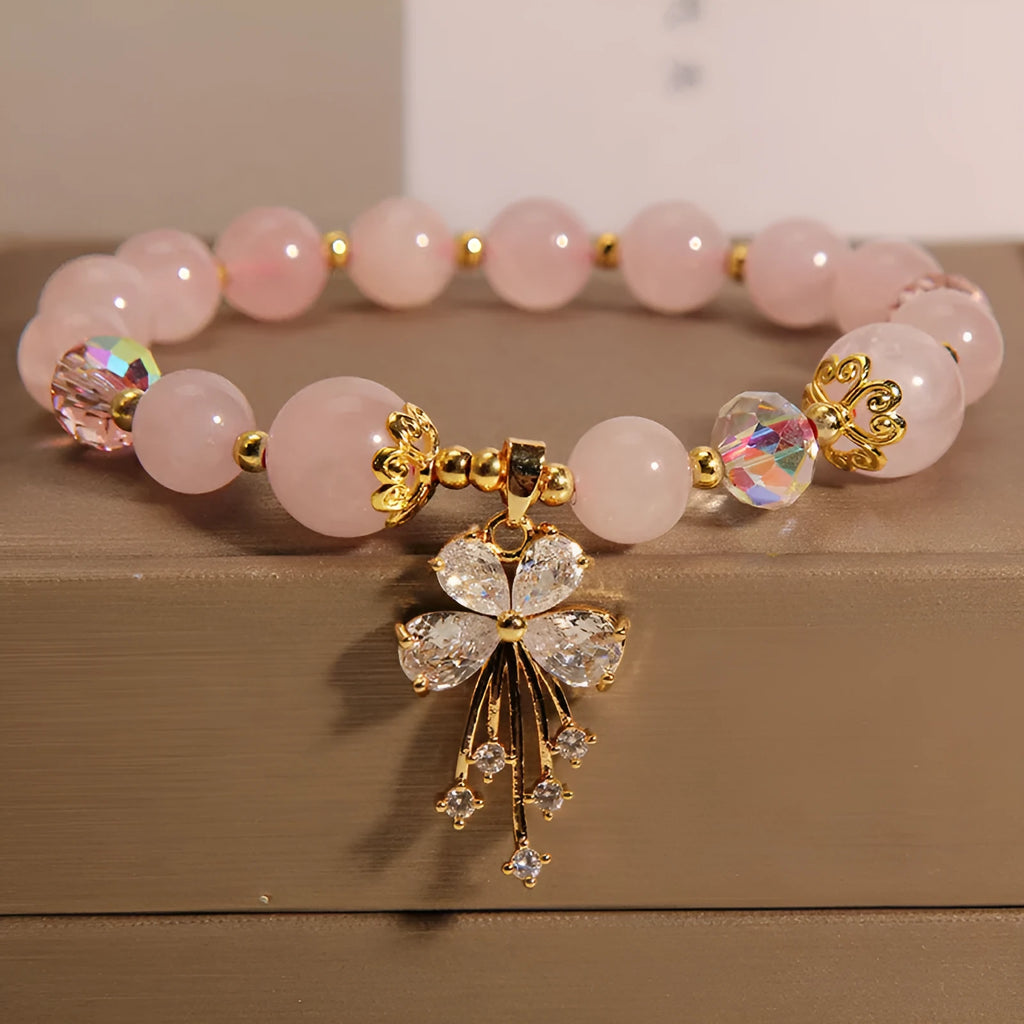 Unisex crystal bead bracelet in aquamarine butterfly colour on neutral background