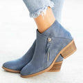 Women's blue suede ankle boots with a side zip and chunky heel on a white background.