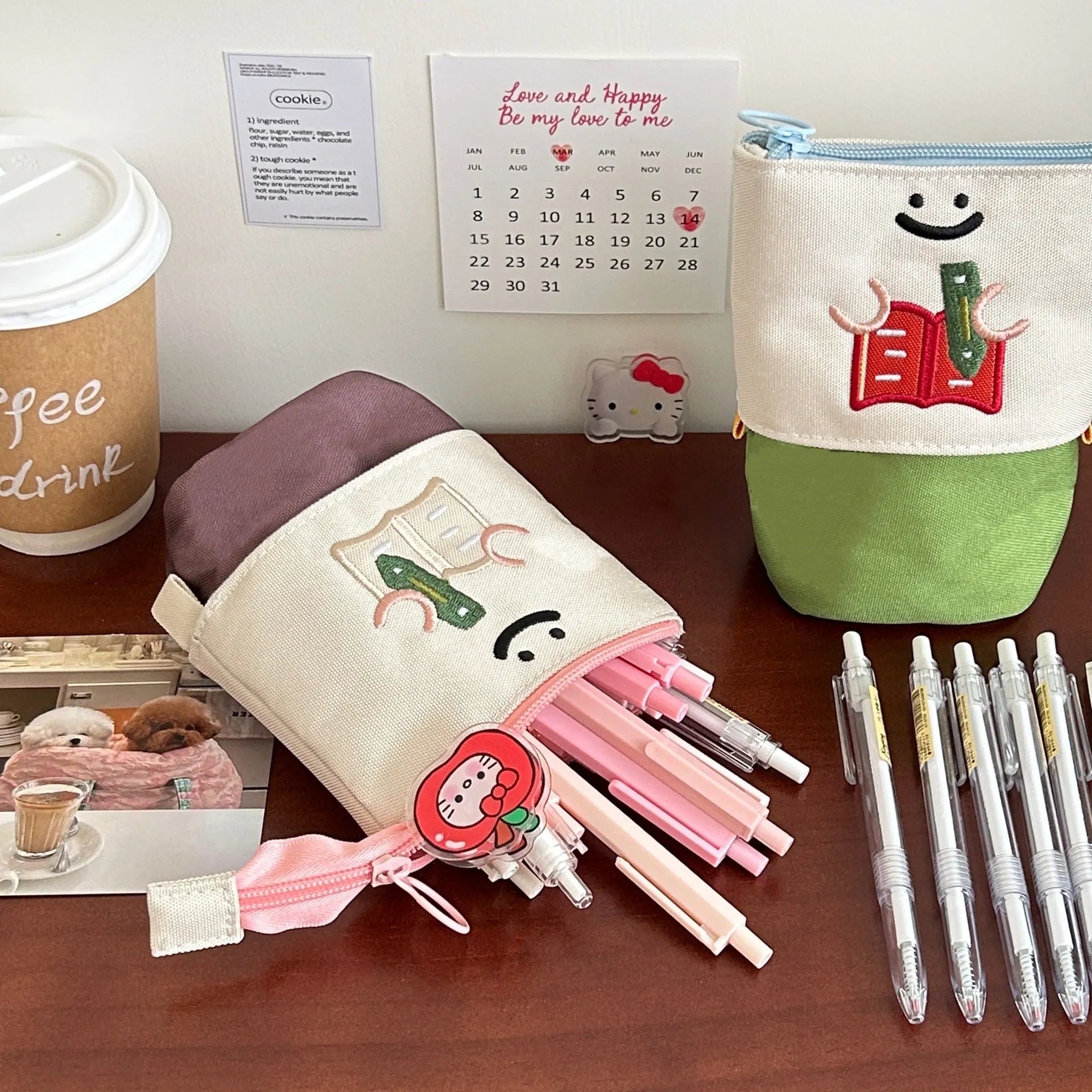 Brown and green cartoon design collapsible pencil case with zipper, showing flat and expanded states.
