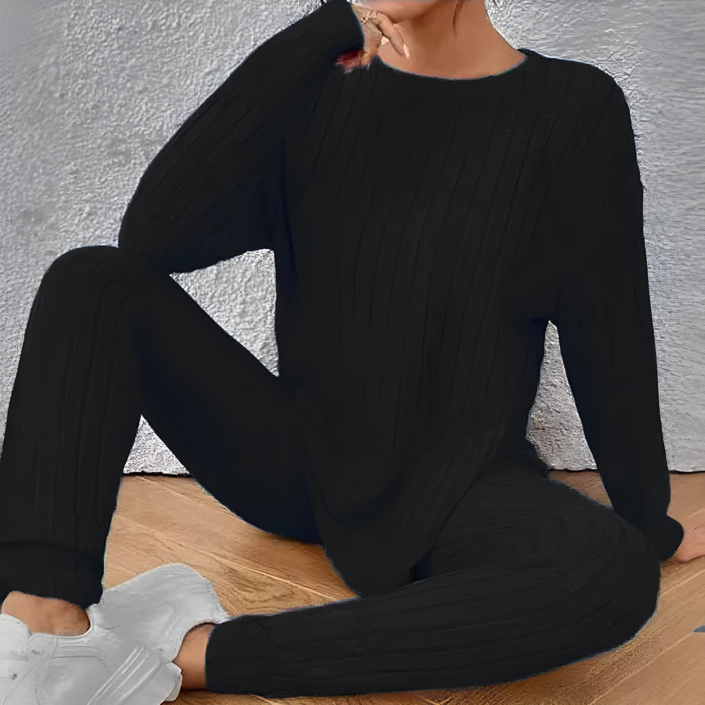 Women's black sunken stripe polyester two-piece loungewear set with regular sleeve top and matching trousers