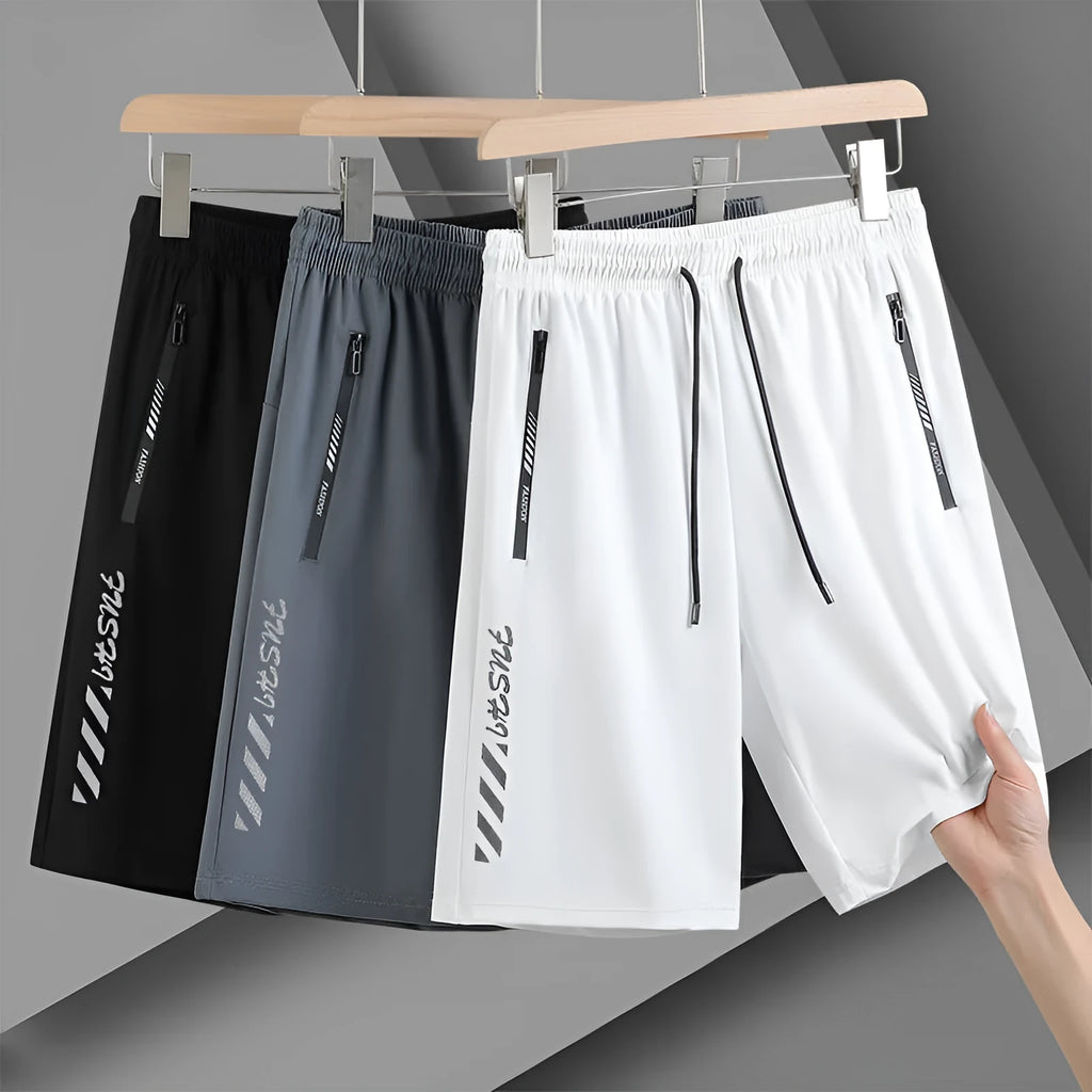 Men's black nylon quick-drying sports shorts with loose fit and elastic waistband.