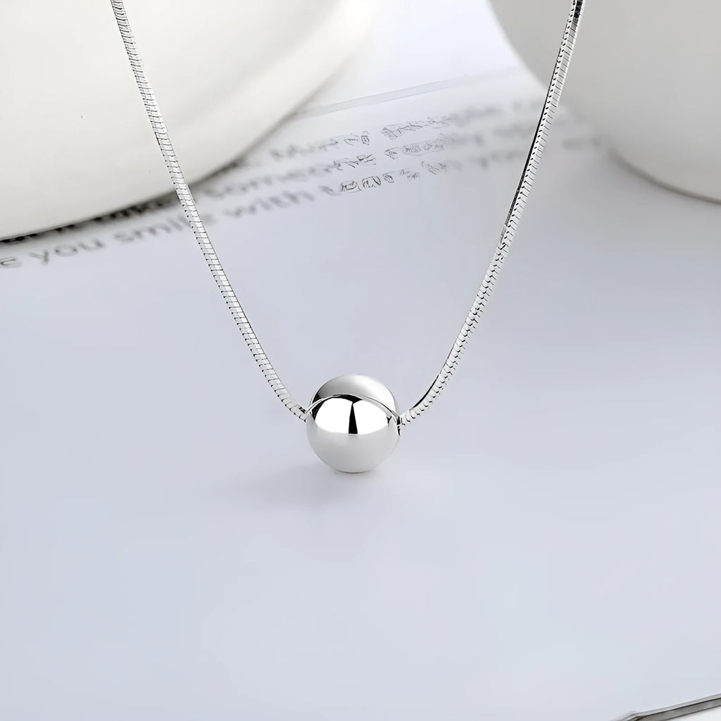 925 sterling silver clavicle chain necklace with round ball pendant on woman's neck