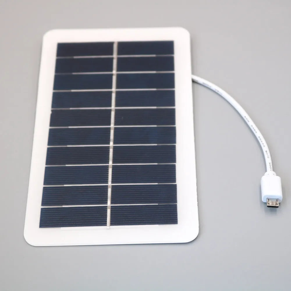 Portable black solar panel mobile phone charger with USB output and PET surface