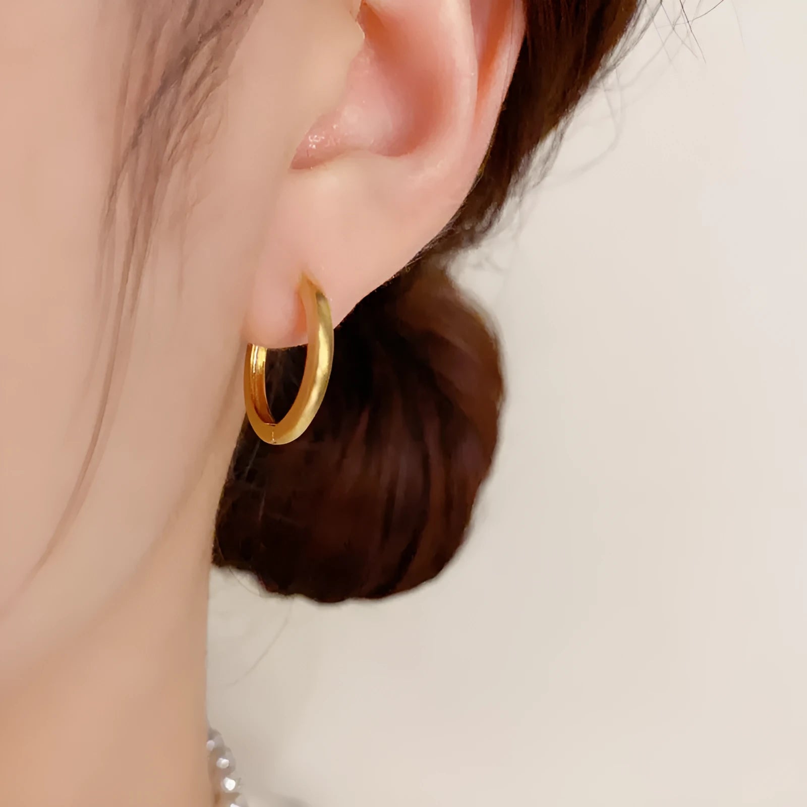 Geometric copper ear clip with real gold plating in simple women's jewellery design