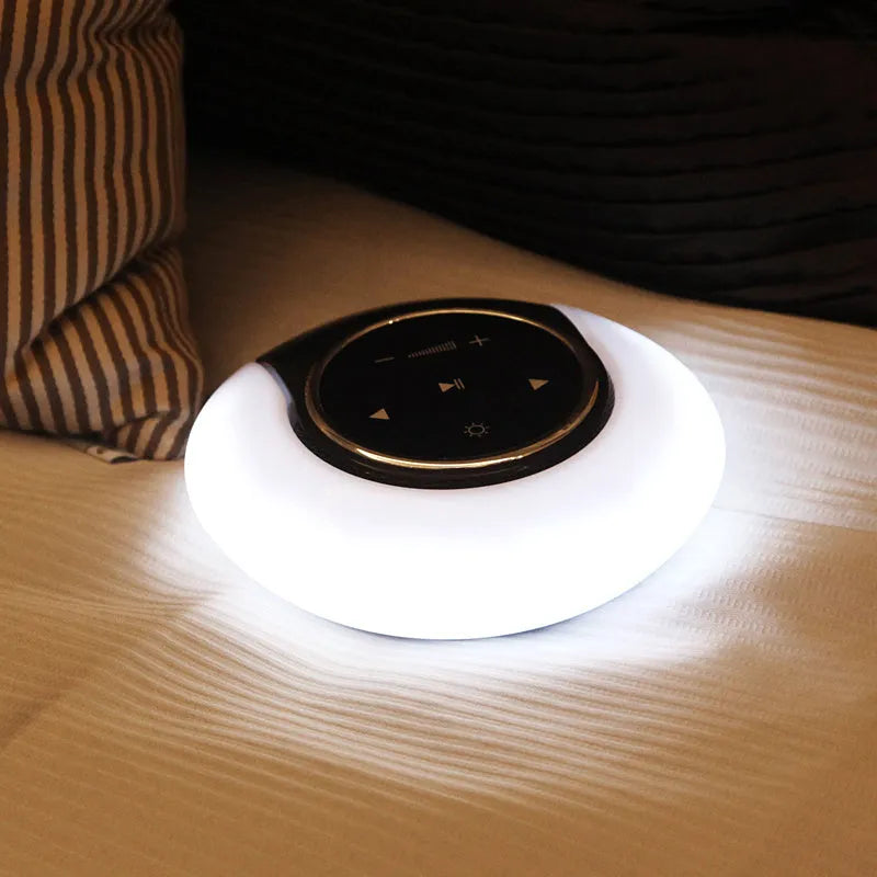 Blue folding Bluetooth desk lamp speaker with touch controls and LED light.