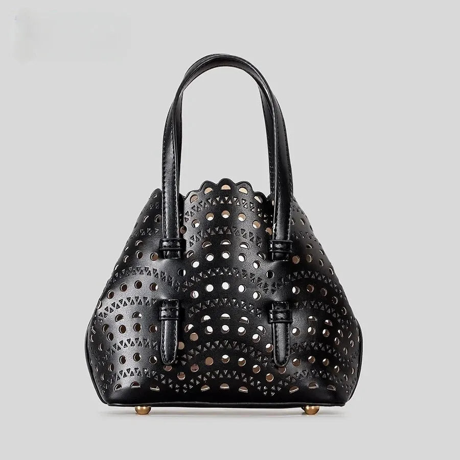 Hollow carved PU tote bag in horizontal square shape with three shoulder straps, available in various colours