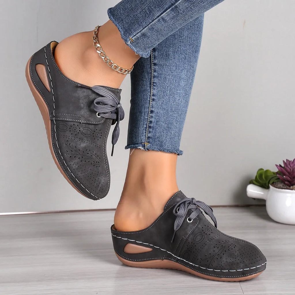 Women's light grey suede lace-up wedge slippers with a hollow-out rubber sole.