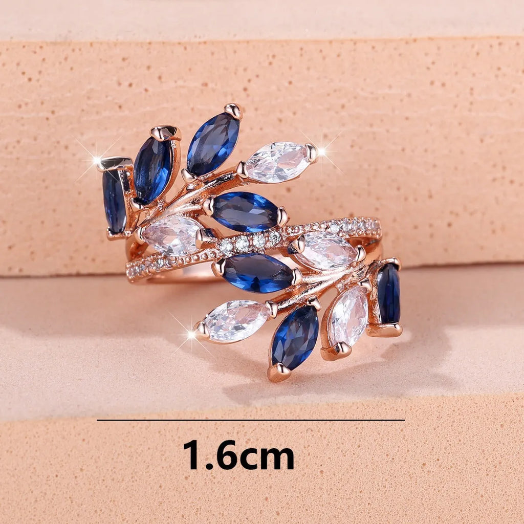 Adjustable copper leaf ring with zircon stones in various colour settings including platinum and rose gold options