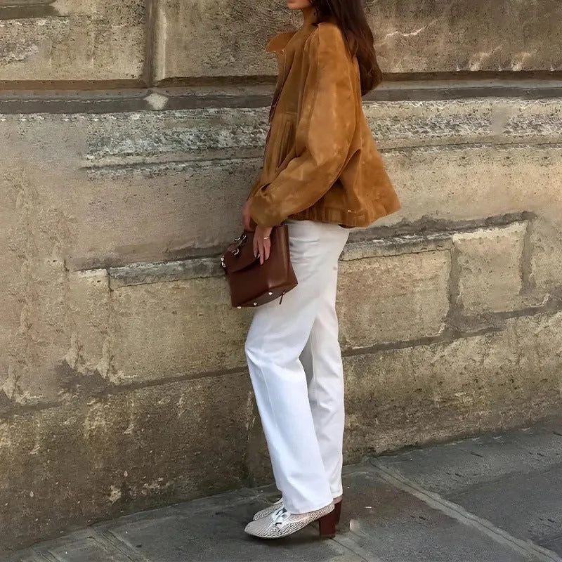 Loose fit solid colour retro jacket with long sleeves on a hanger.