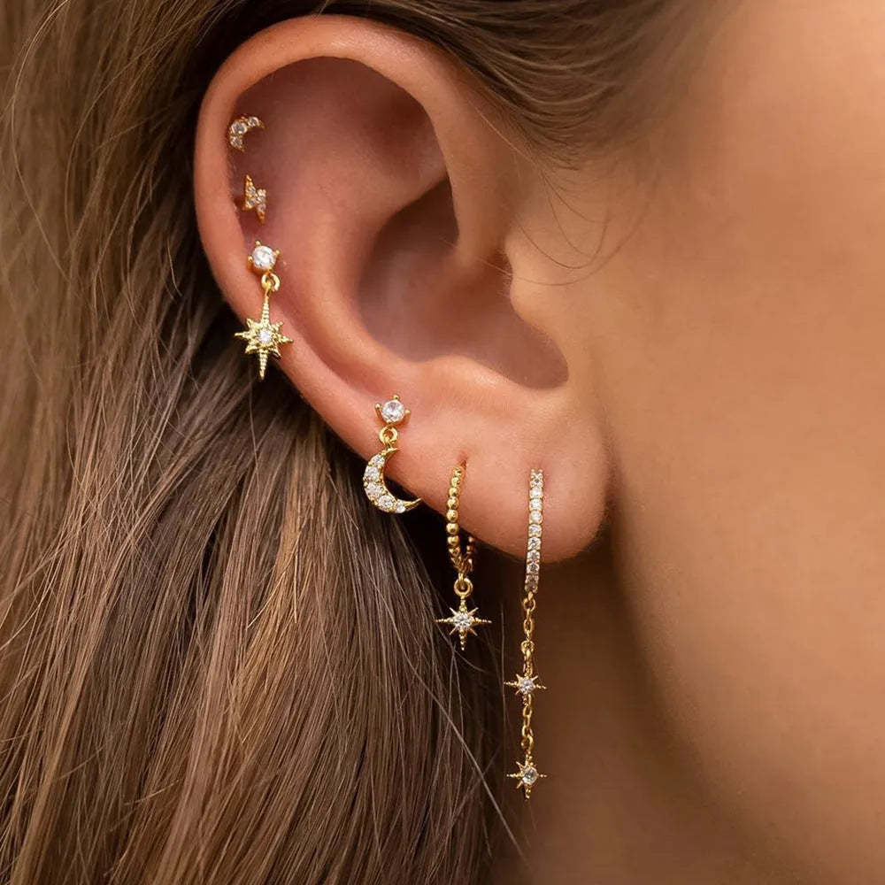 Six gold electroplated zircon stud earrings with chain tassel designs on copper base