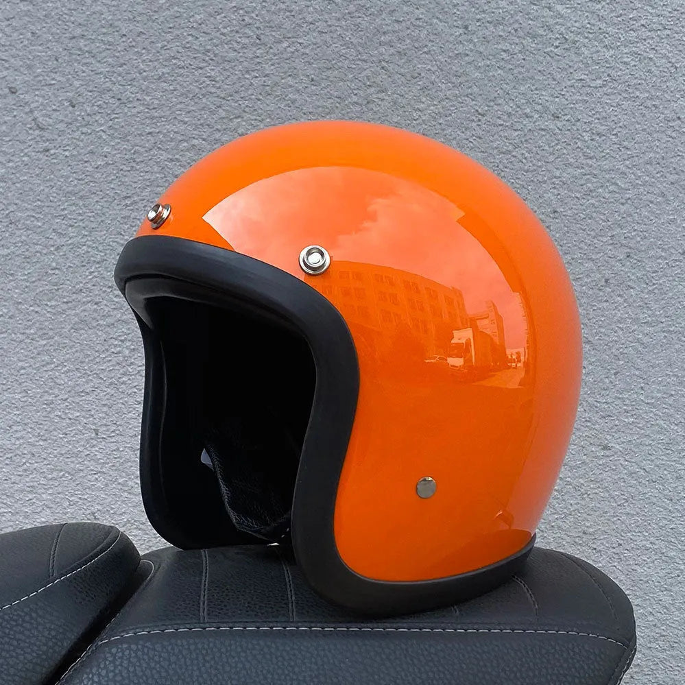 Retro-style open-face motorcycle helmet in glass fibre construction shown in a cement grey colour.