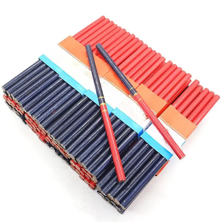 Ten red and blue round wooden carpenter pencils for marking, laid out on a work surface.
