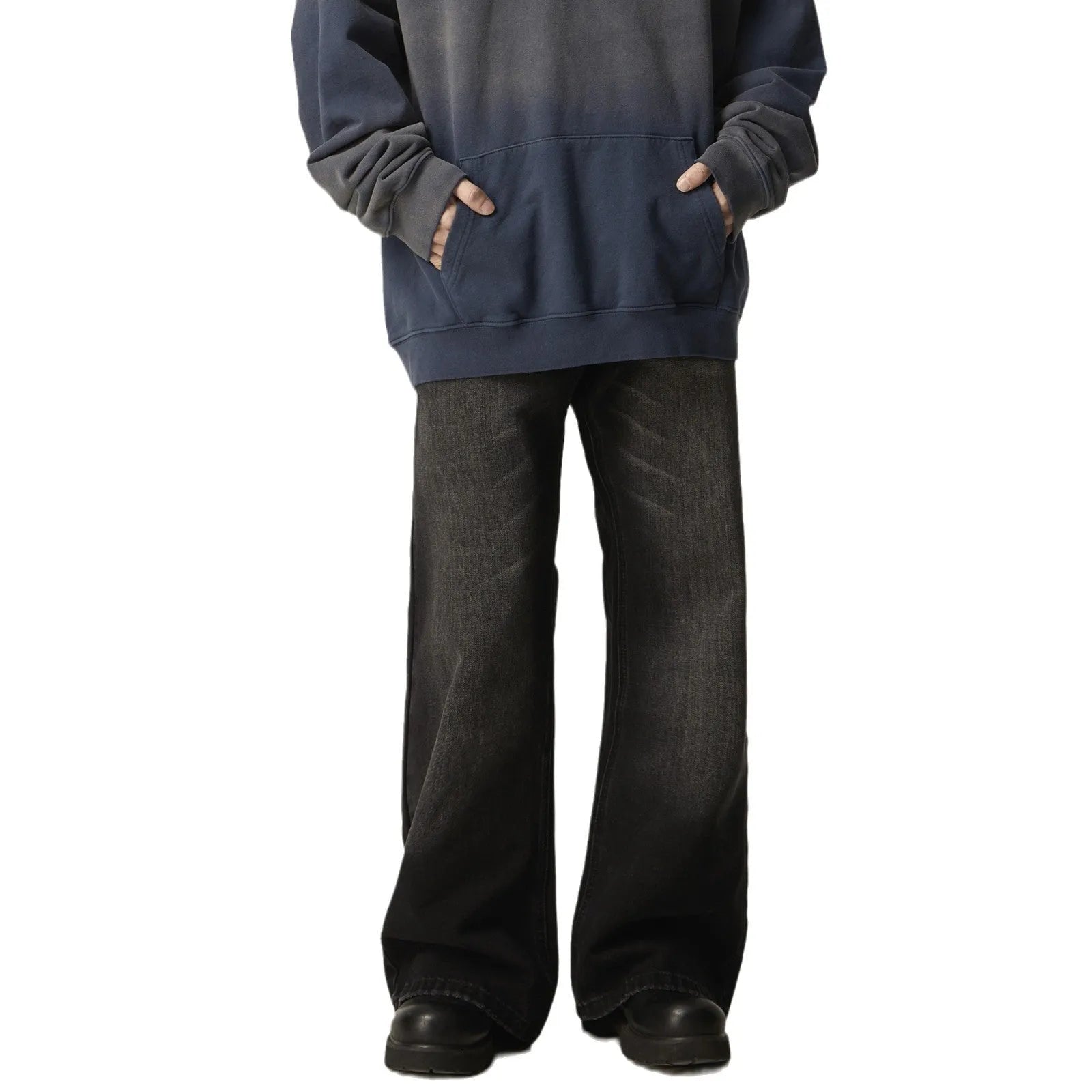 Man's black loose-fit straight-leg jeans with a retro style on a plain background.