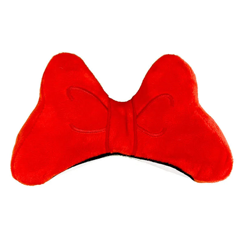 Plush fabric bow decoration for motorcycle and ski helmets in red, peach pink, or rose pink.