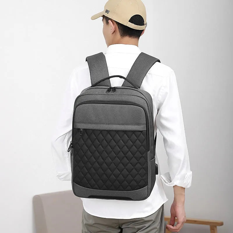 Men's black leisure travel backpack made from Oxford cloth with diamond mesh detail and curved shoulder straps