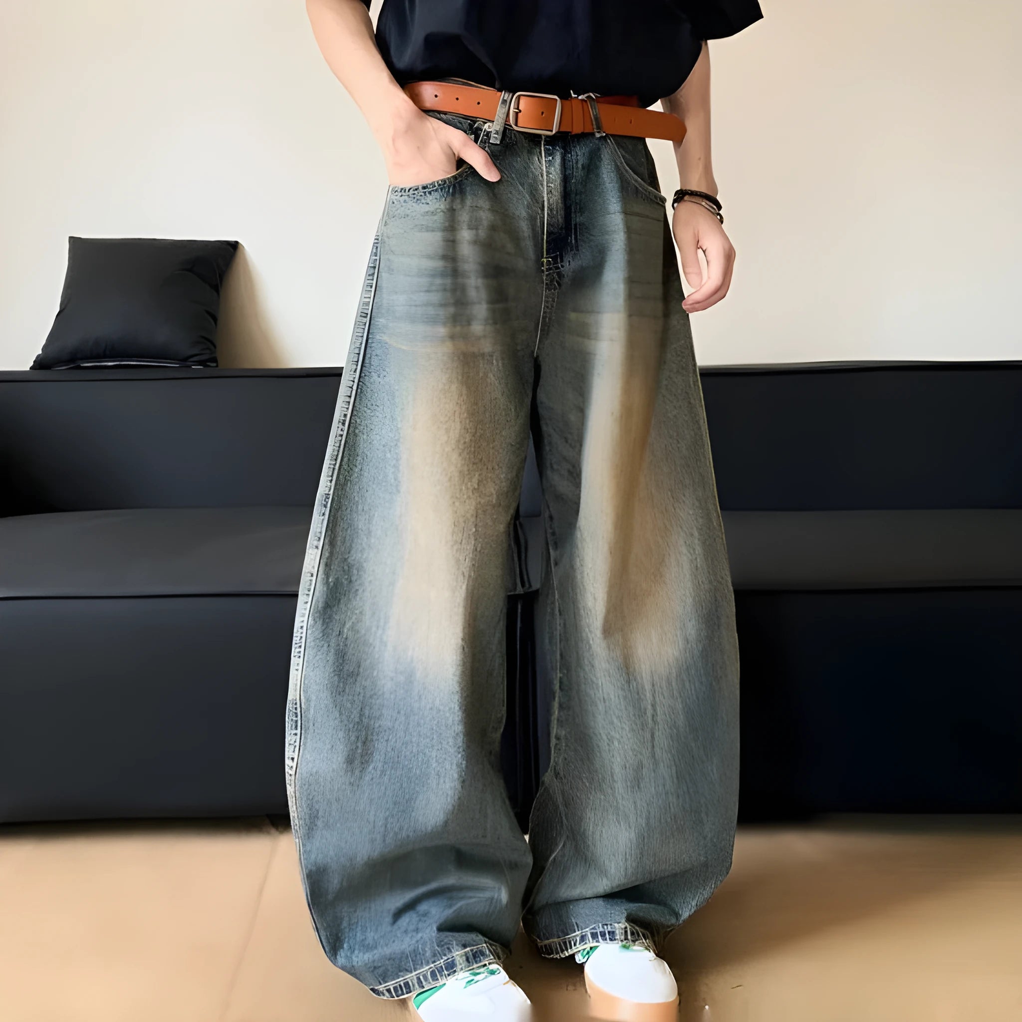 Men's retro blue distressed denim trousers with wide leg cut and vintage wash detailing