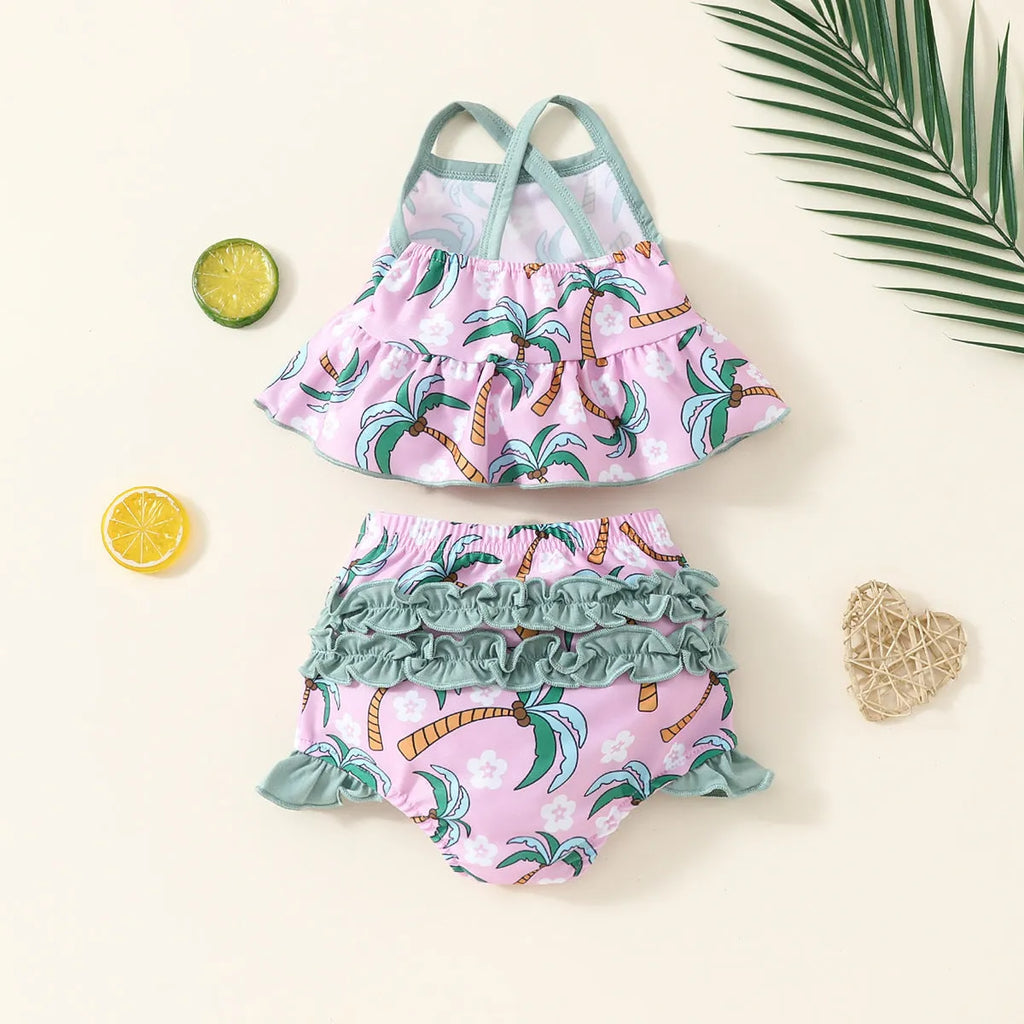 White two-piece toddler swimsuit set with a top and matching shorts on a hanger.