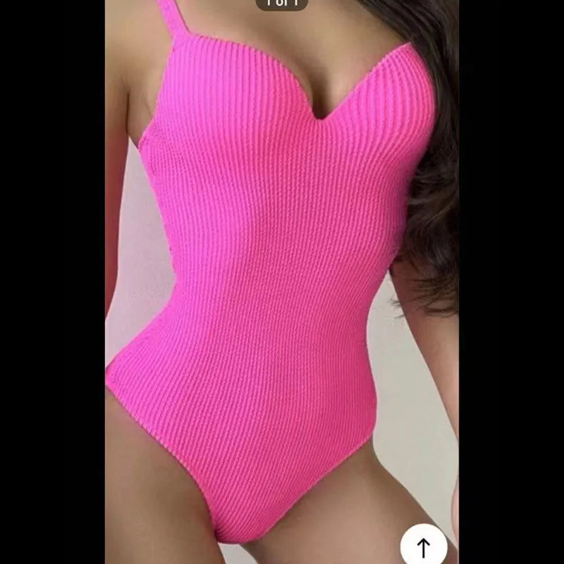 Women's black one-piece swimsuit with sunken stripe pattern and sleeveless design