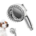 Silver 2 in 1 dog shower attachment with soft silicone comb teeth and ergonomic grip on white background