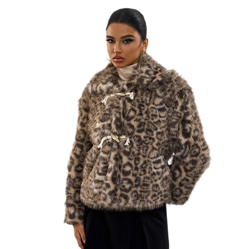 Women's leopard print coat with a buckle lapel closure and regular sleeves.