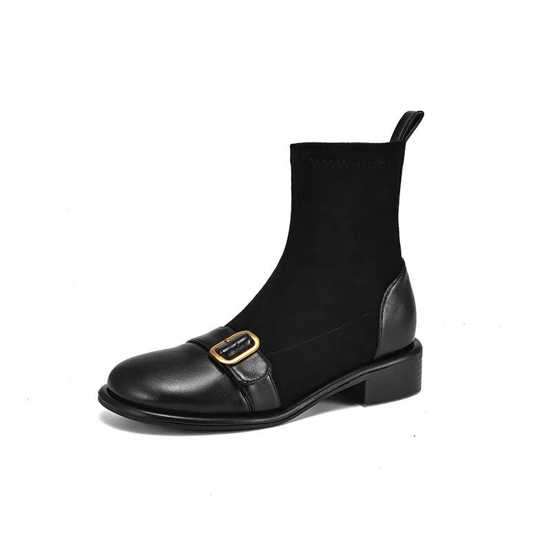 Women's black low heel Martin ankle boots with belt buckle stitching and lace-up front.