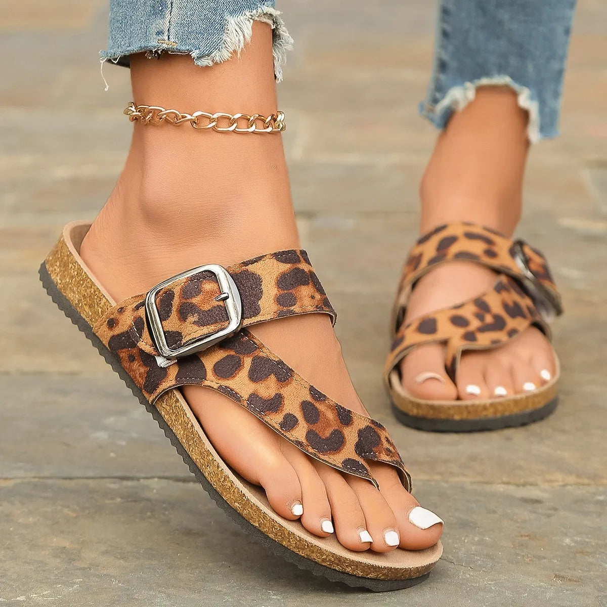 Roman style toe covering leopard slippers with wooden sole on neutral background