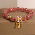 Women's strawberry quartz bracelet with four-leaf clover dream catcher pendant and silver ball charms