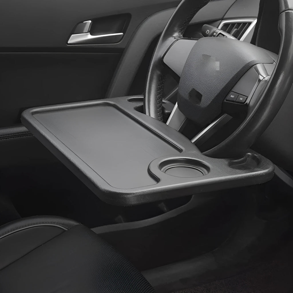 Black plastic car computer desk and dining tray measuring 42 x 28cm on a car seat