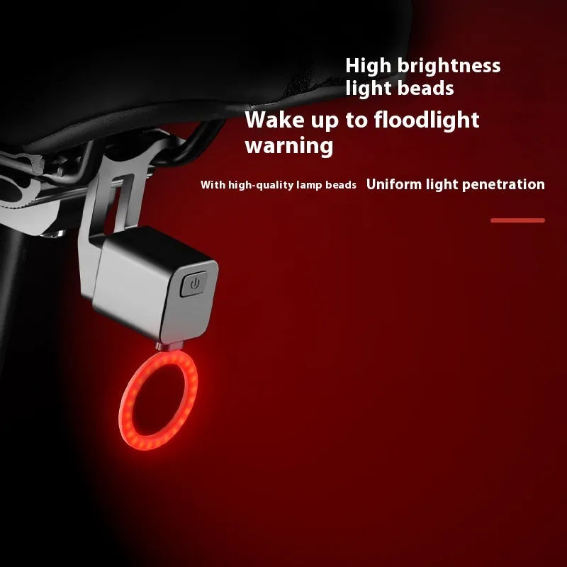 Bicycle tail light with flowing water effect mounted on seat tube for night riding safety