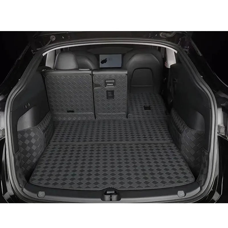 Leather trunk mat for Tesla Model 3 in black with buckle fitting lying in boot