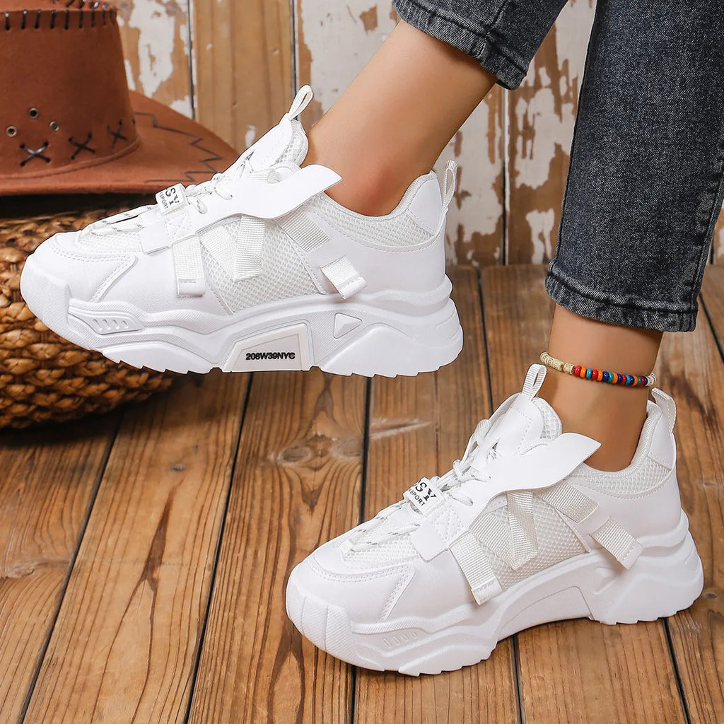 Women's purple platform mesh dad shoes with lace-up front, shown on a fitness floor.
