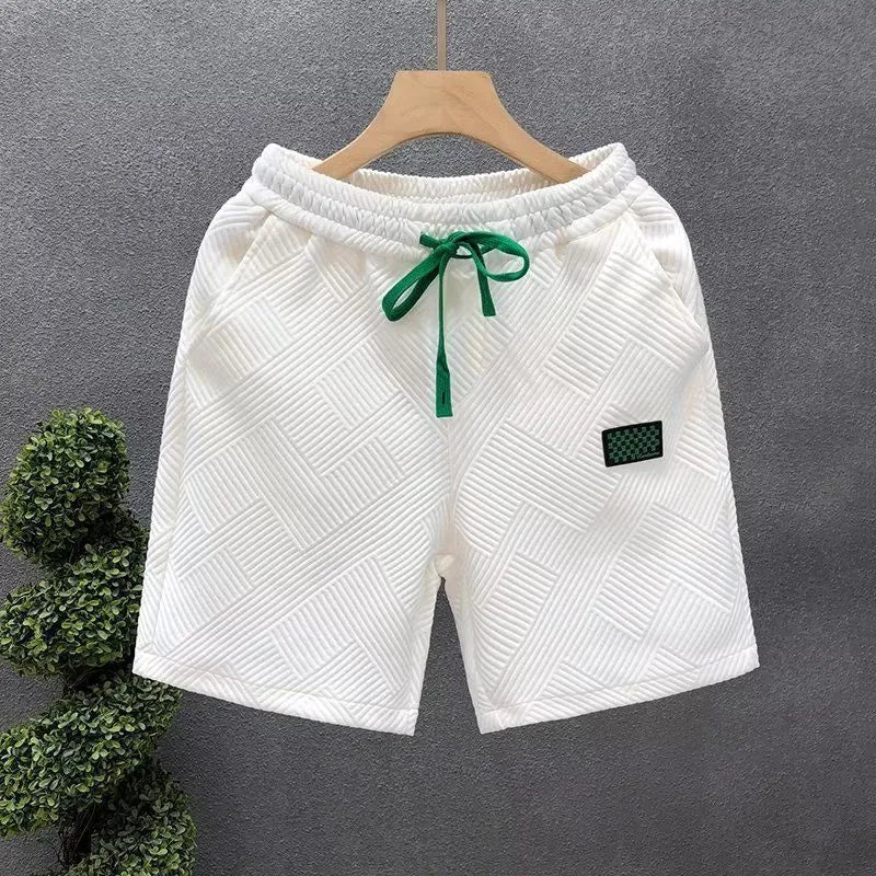 Casual micro-elastic polyester sports shorts in solid white, black, or green colours with American style design