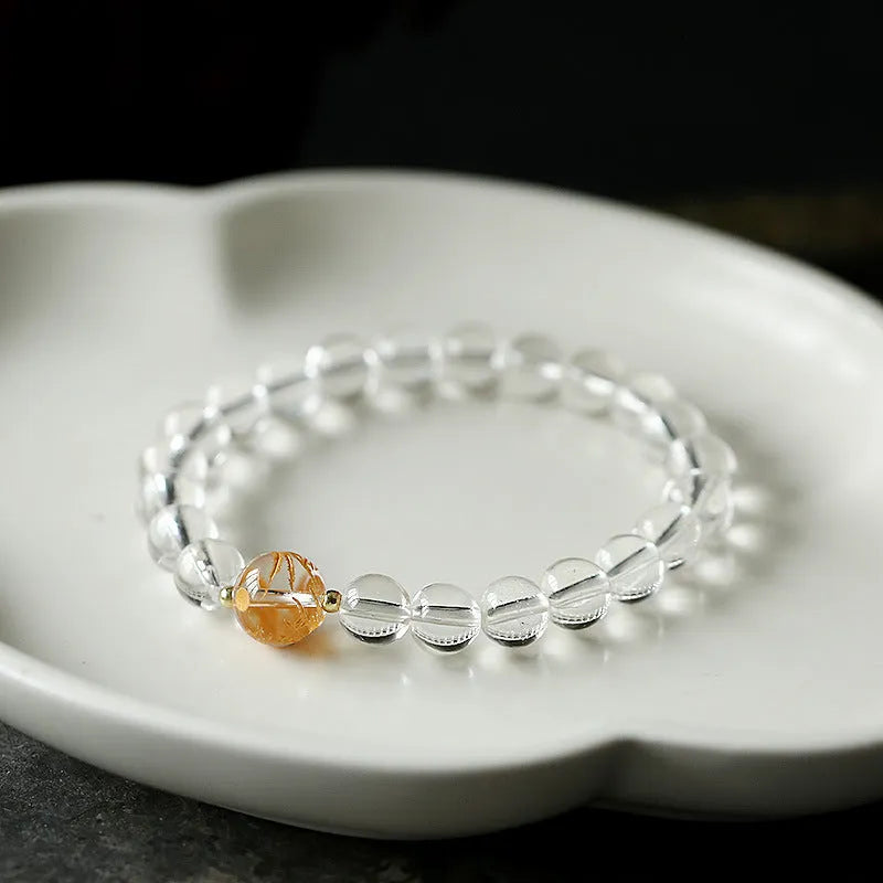 Unisex obsidian black agate white crystal bracelet with 10mm and 8mm beads on neutral background