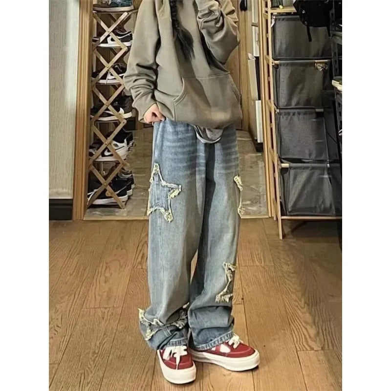 Blue high-waisted wide-leg women's denim trousers on a hanger.