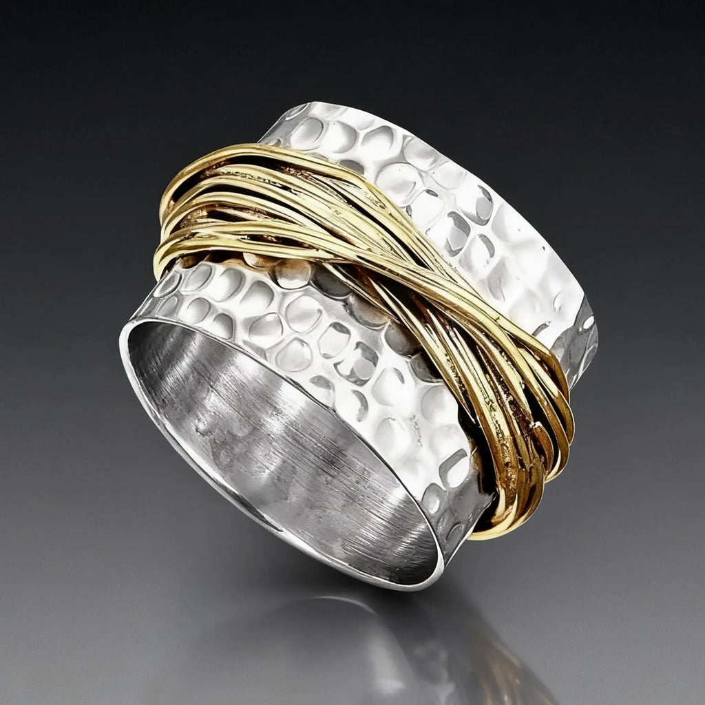 Alloy two-tone ring with hammered metal coil design, electroplated finish, on white background