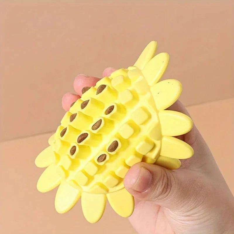 Yellow rubber sunflower dog toy for teething puppies on a light background