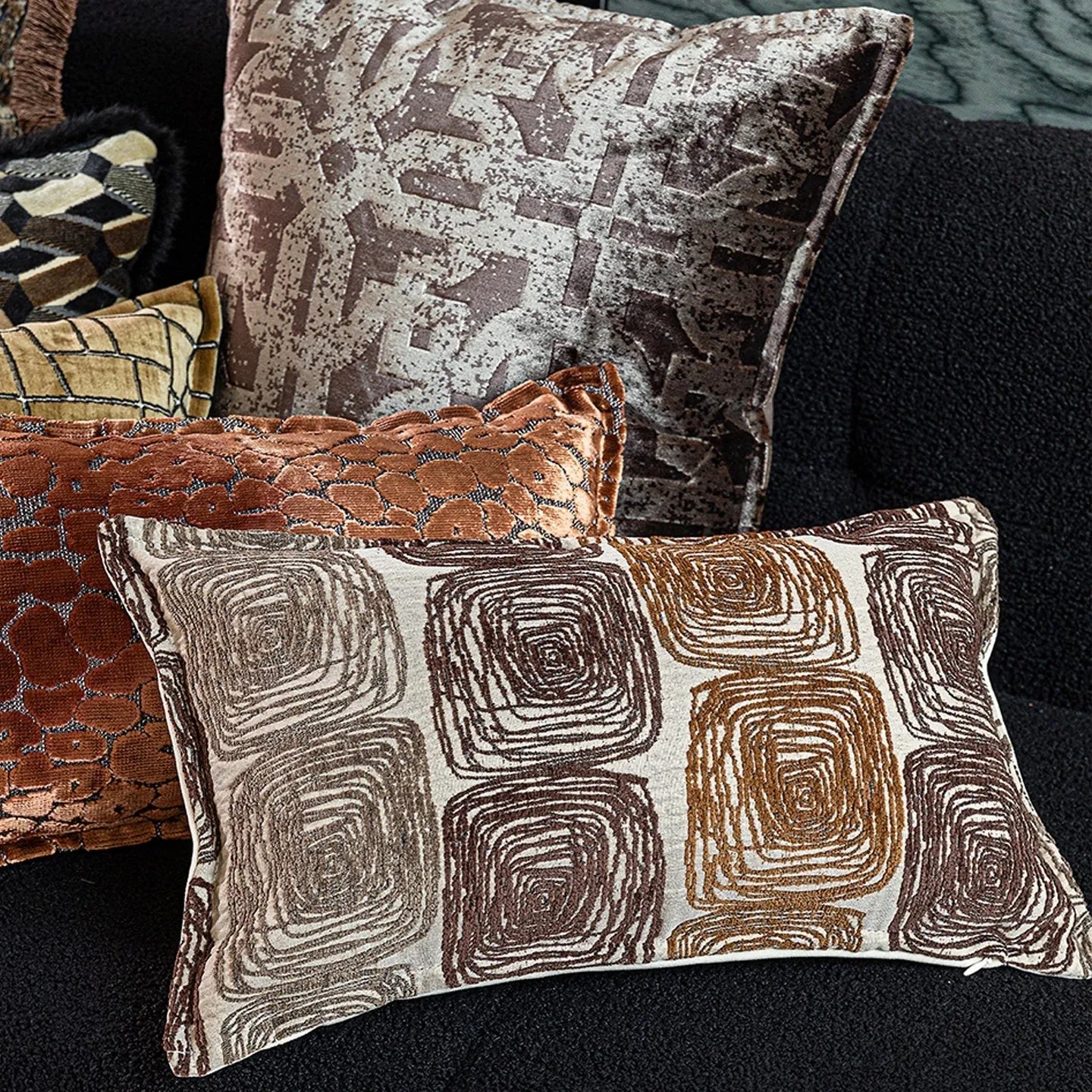 Abstract coil pattern pillow cover in cream and coffee colours with feather velvet texture