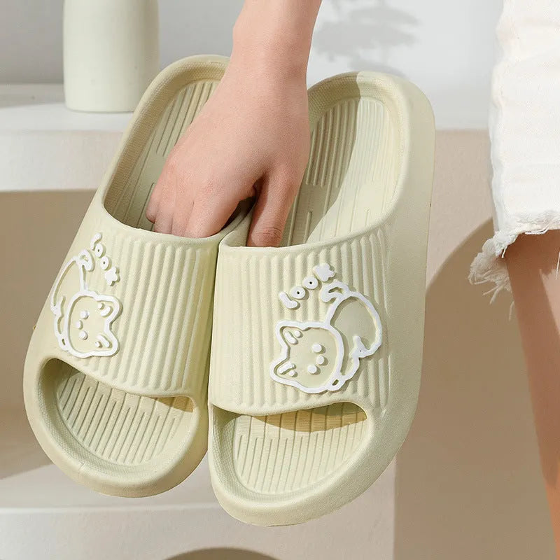 Green EVA platform slippers with a cat design on the upper, showing the thick non-slip sole.