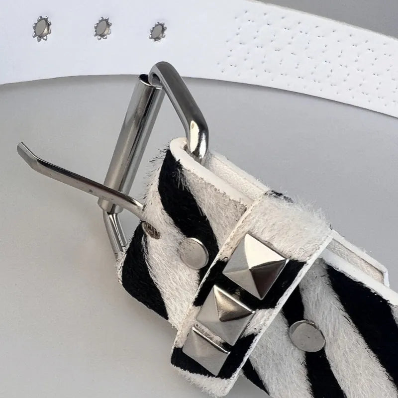 Punk women's belt with metal rivets in leopard or zebra print patterns showing alloy buckle
