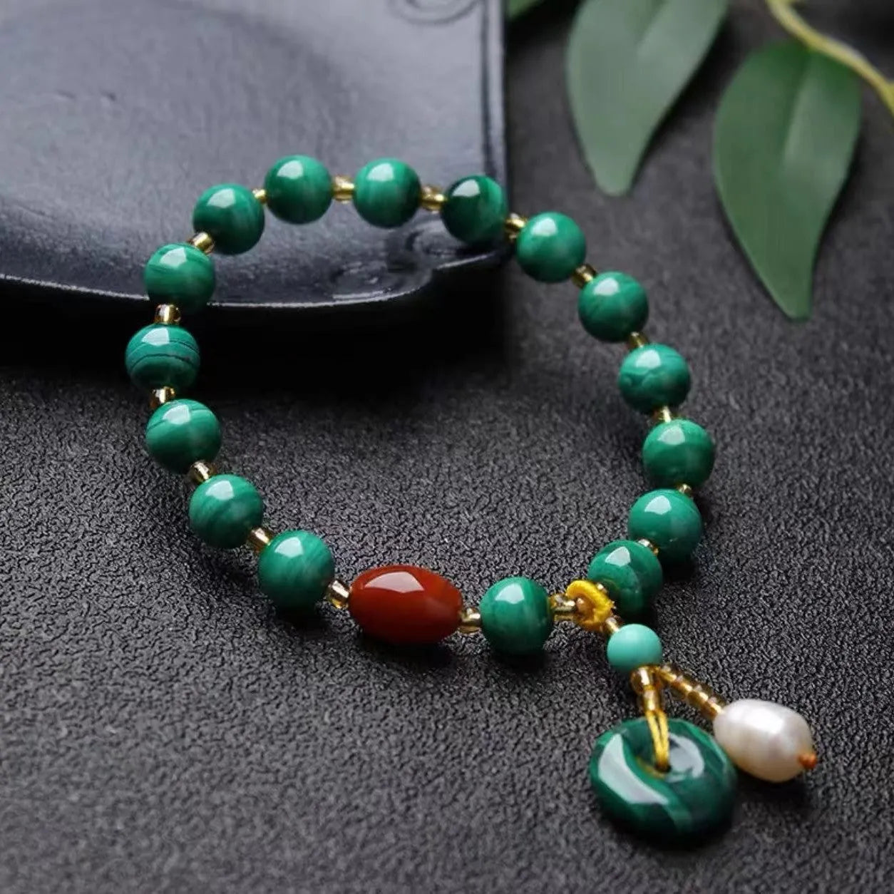 Natural green malachite and red agate barrel bead bracelet measuring 7-8mm with handcrafted unisex design