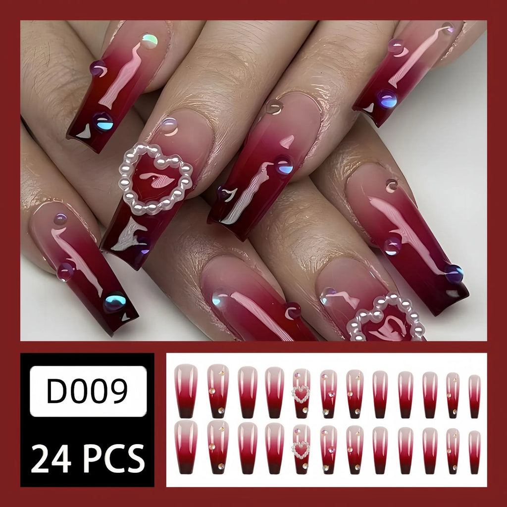 Wine red gradient fake nail tips with pearl heart decoration and plaid pattern in long ballet length style.