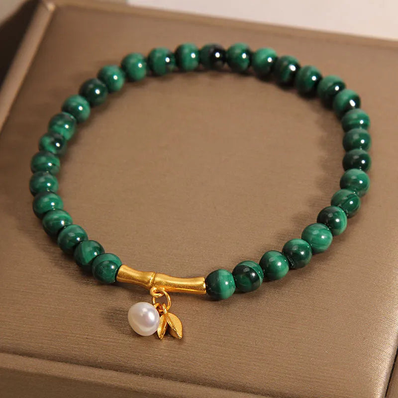 Women's lucky bamboo bracelet with white crystal beads on adjustable gold-toned chain