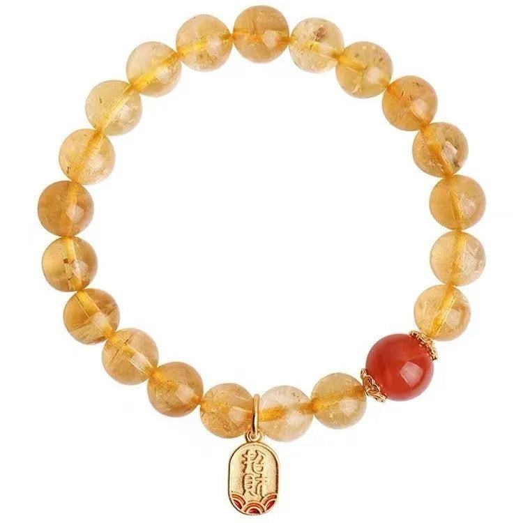 Natural red agate bracelet with gold ruby beads on a light background, polished finish, 8mm size