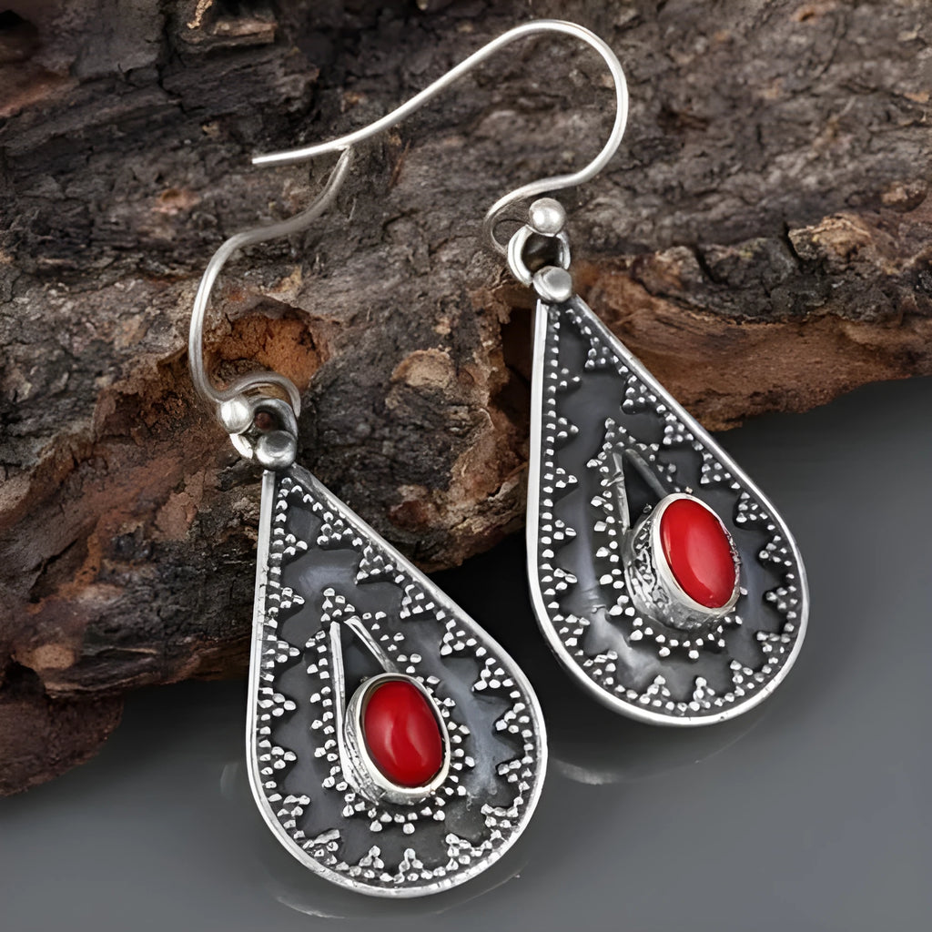 Silver water drop earrings with red pine gemstone centre on zinc alloy body